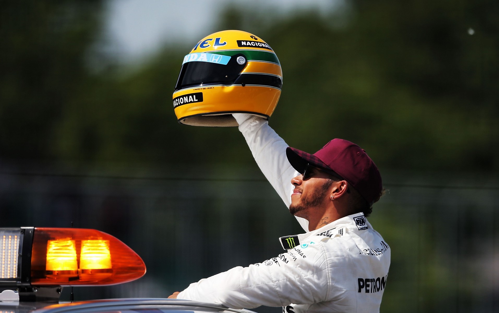Lewis Hamilton with his Ayrton Senna helmet.