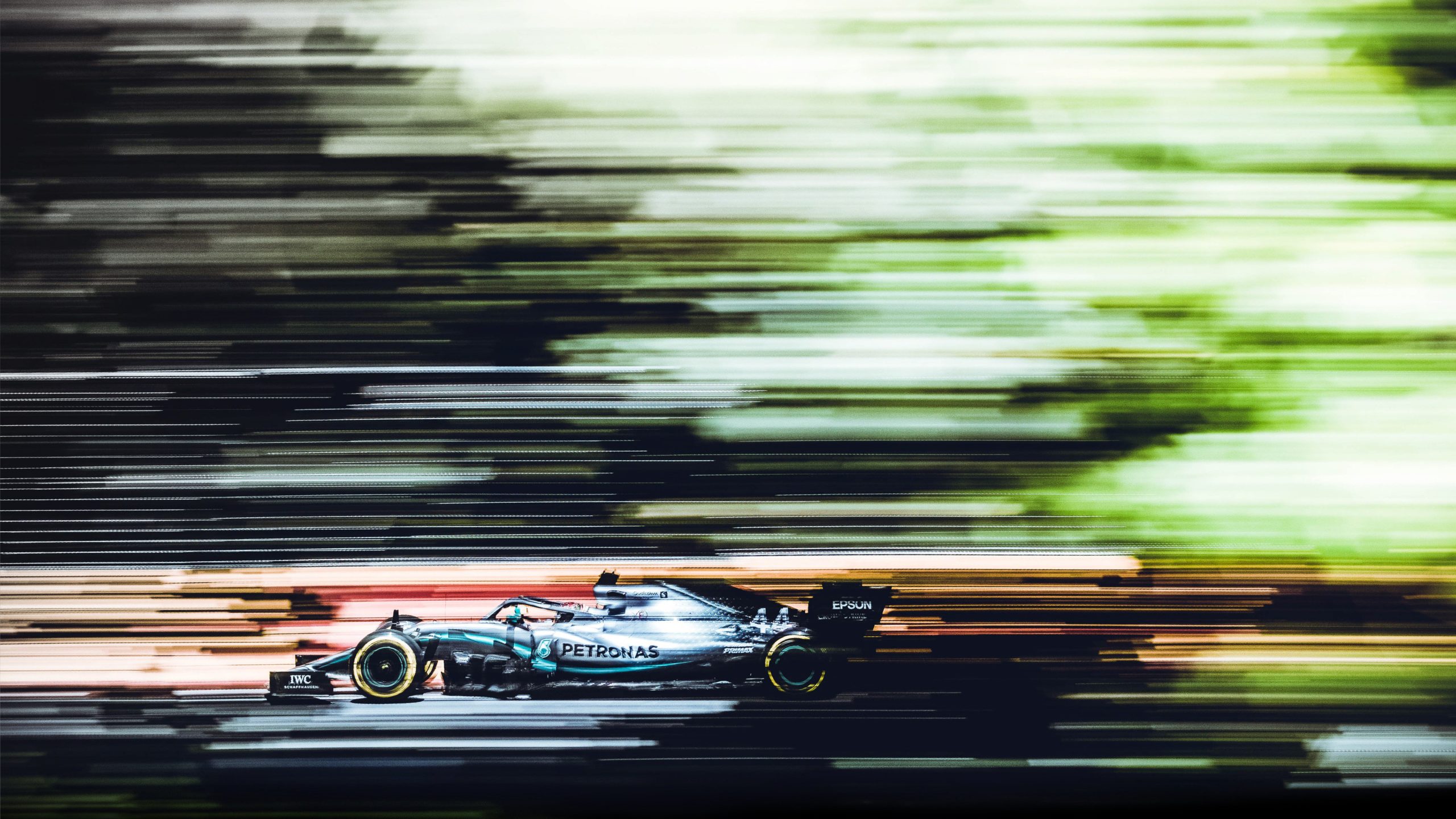 Lewis Hamilton streaks past in his Mercedes.