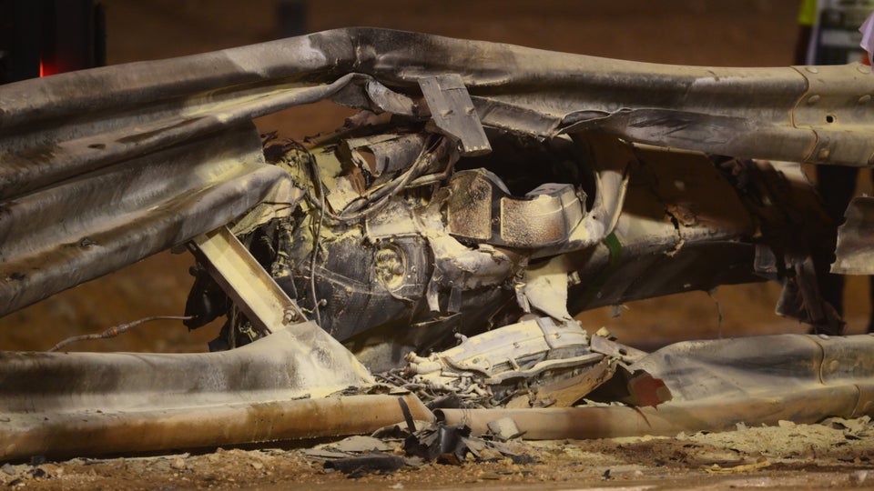 The twisted wreckage of Romain Grosjean's crash at the Bahrain Grand Prix.