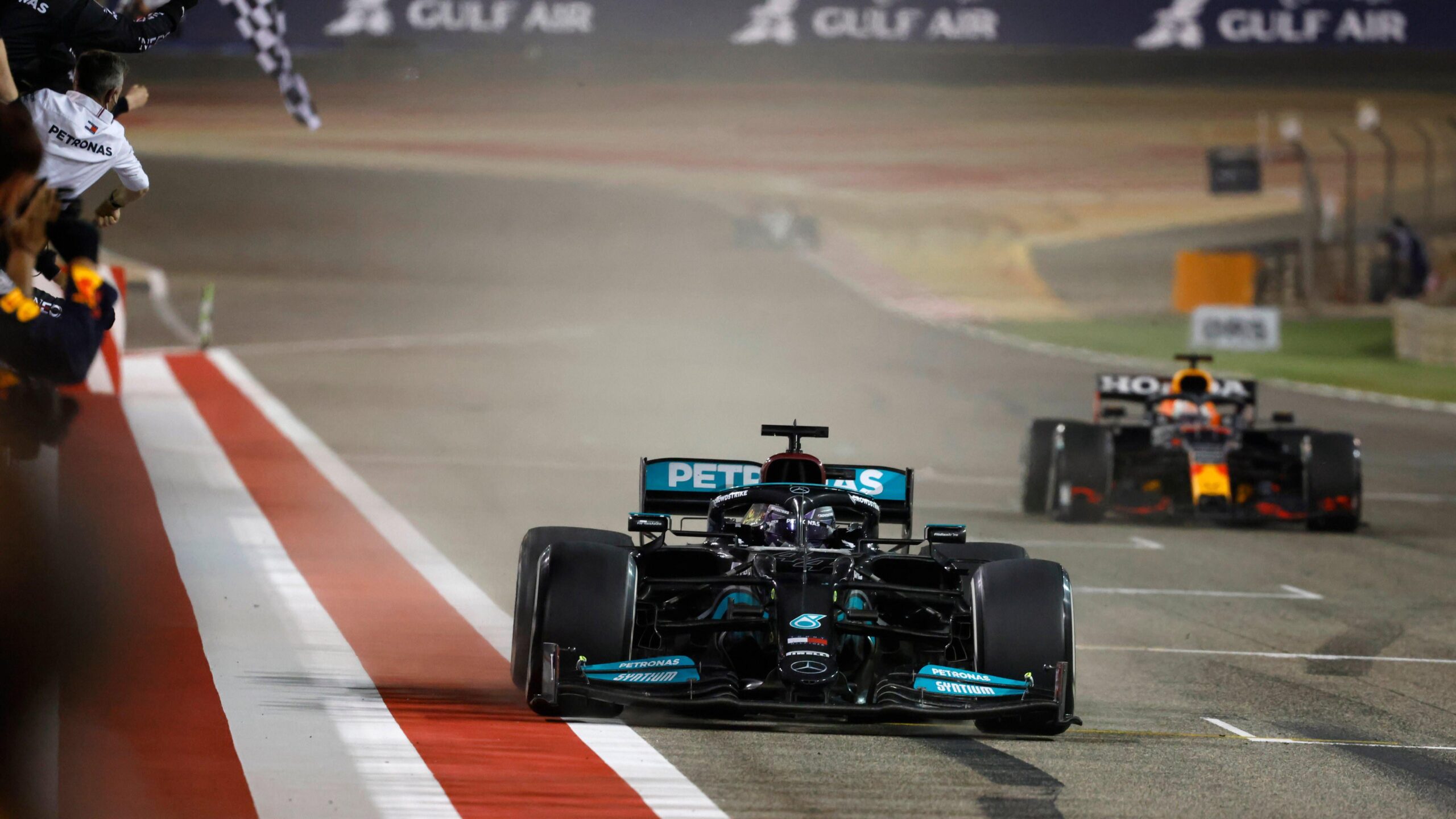 Lewis Hamilton takes the chequered flag.