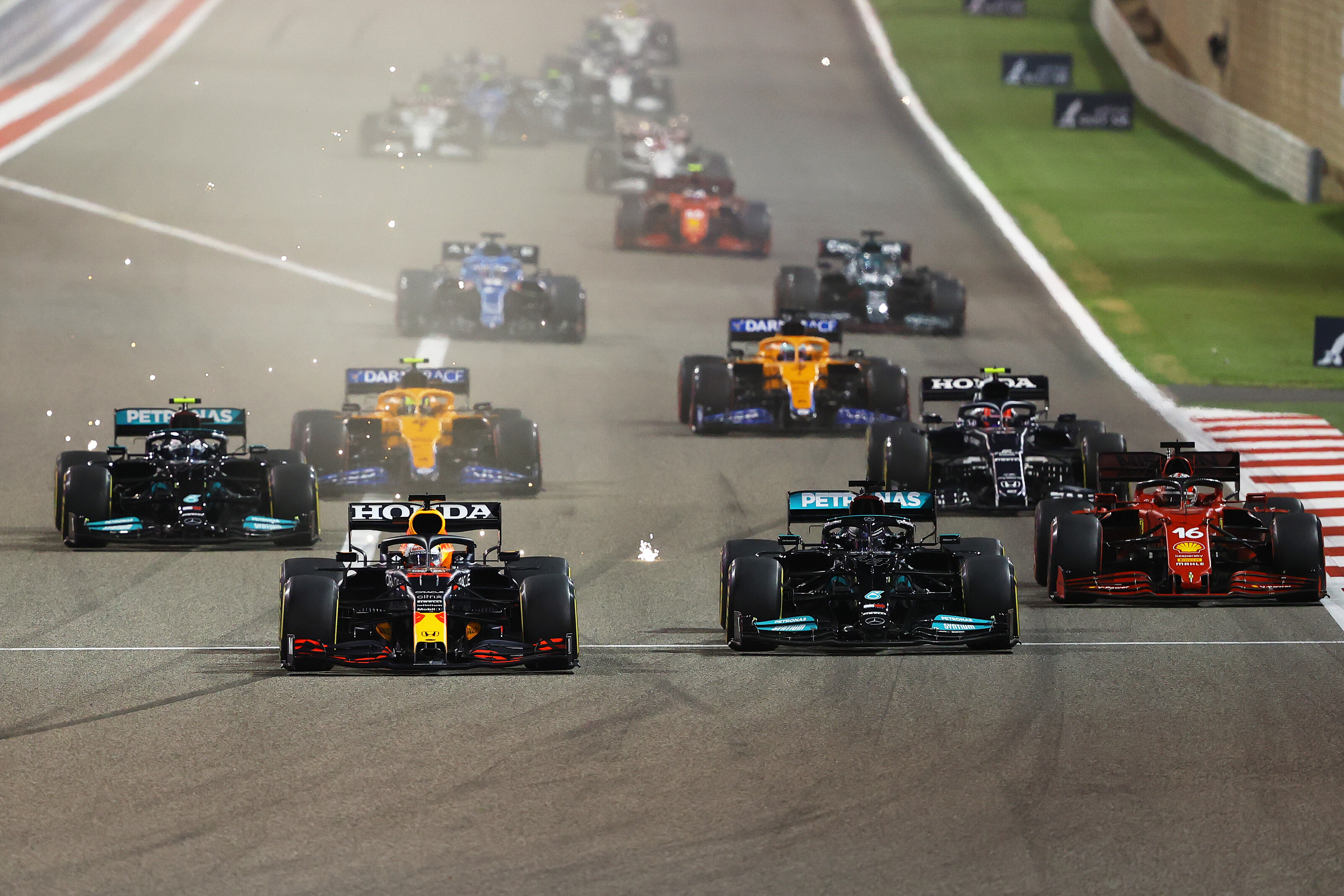 Lewis Hamilton and Max Verstappen go wheel-to-wheel into the first corner at the Bahrain Grand Prix.