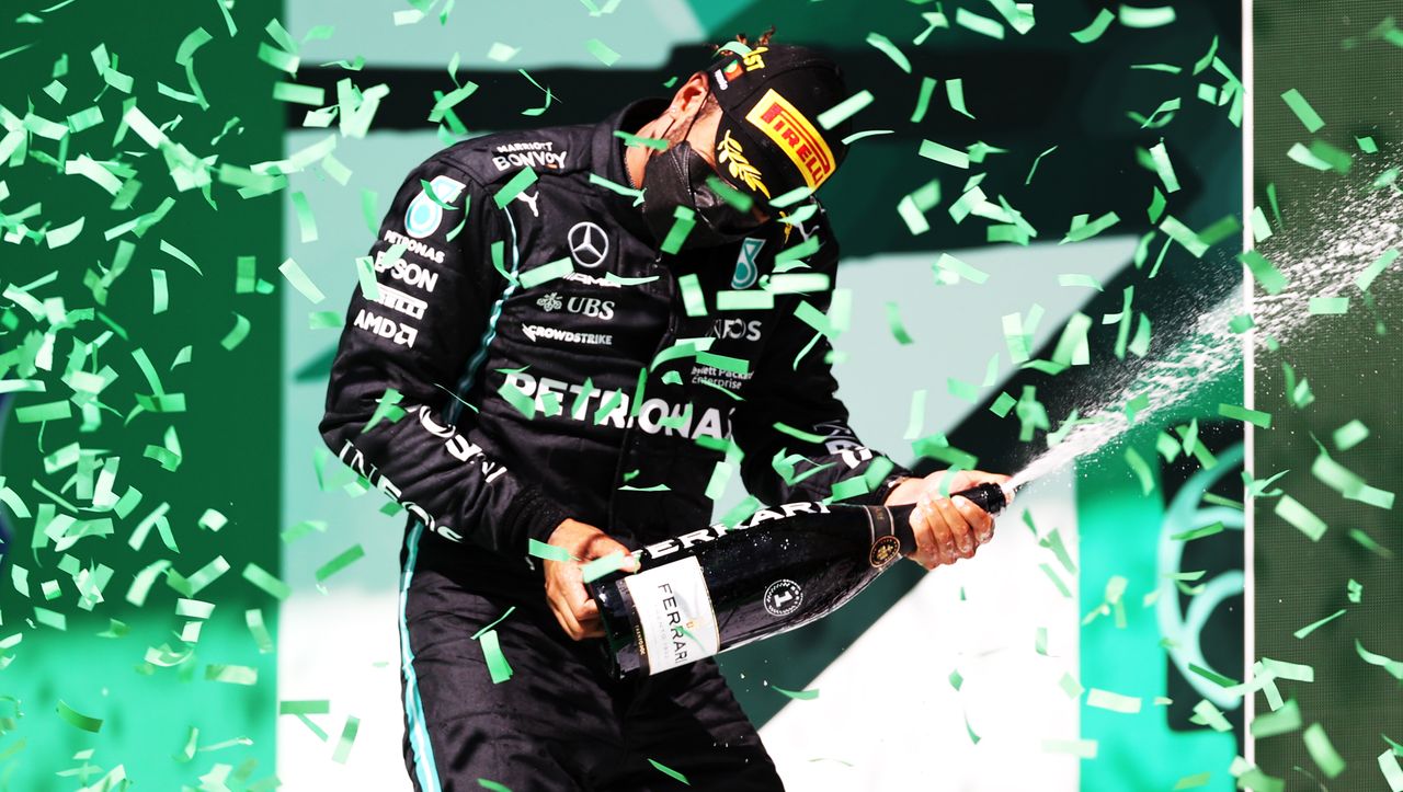 Lewis Hamilton celebrates winning the Portuguese Grand Prix.