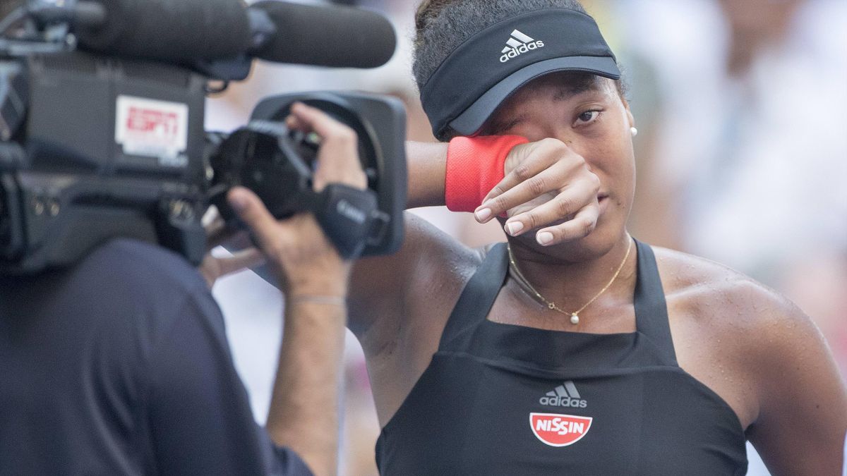 Naomi Osaka being filmed at close quarters.