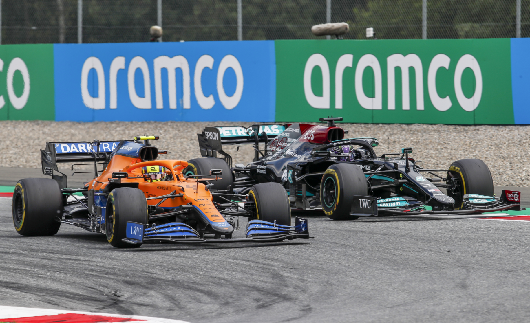 Lando Norris and Lewis Hamilton battle for second place.