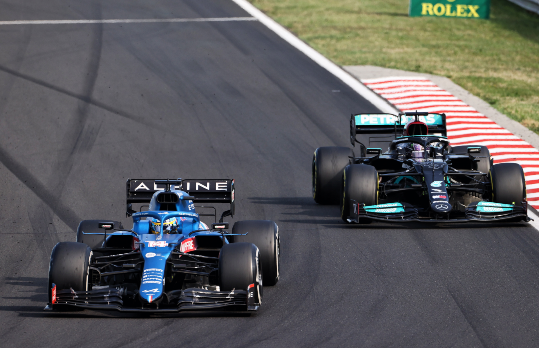 Fernando Alonso and Lewis Hamilton battle at the Hungarian Grand Prix.