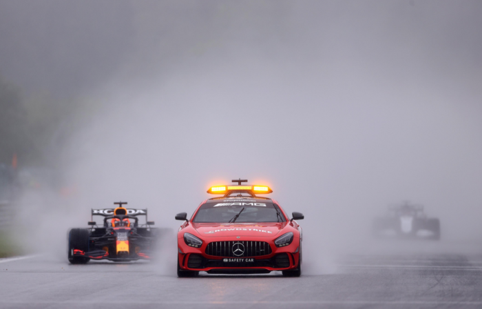 The safety car leads Max Verstappen at the Belgian Grand Prix