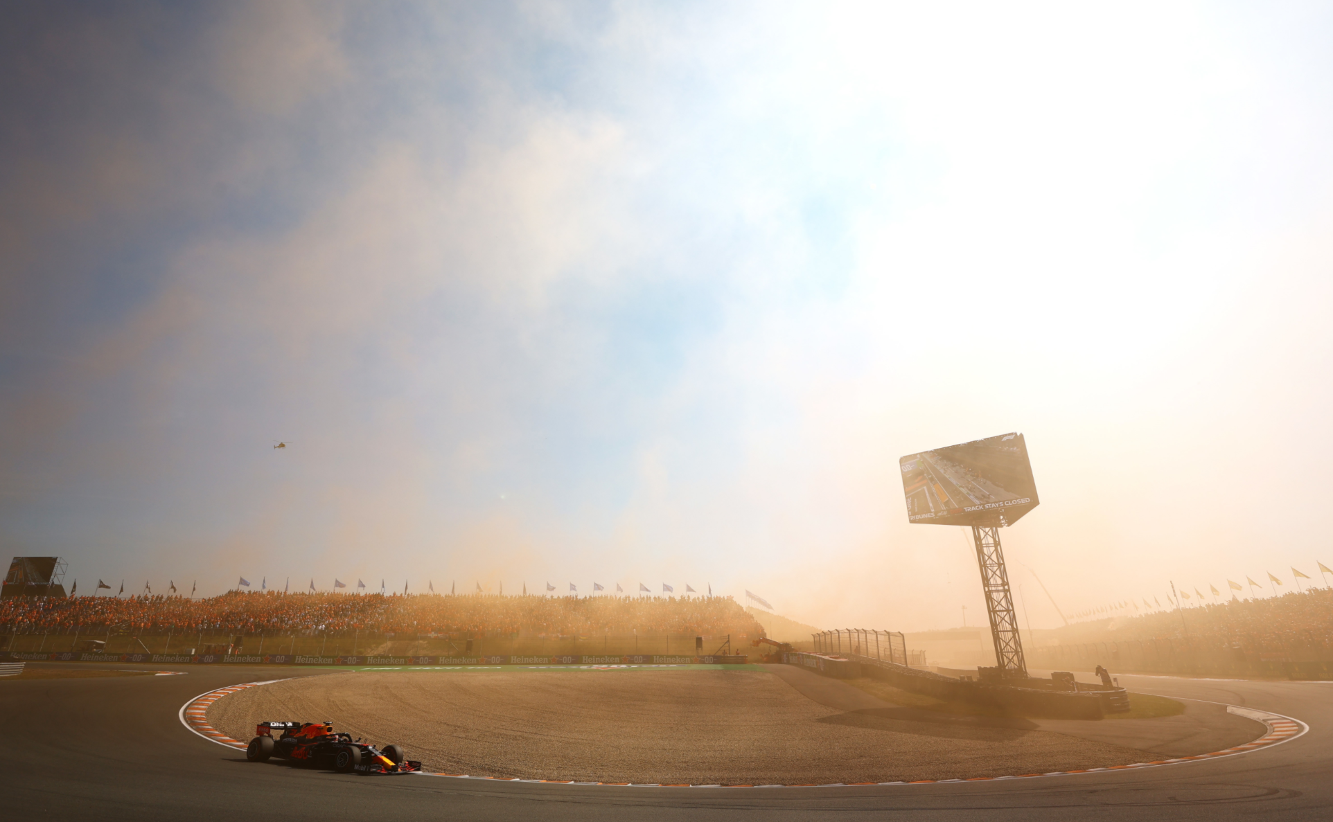 An orange haze from the Dutch fans' flares.