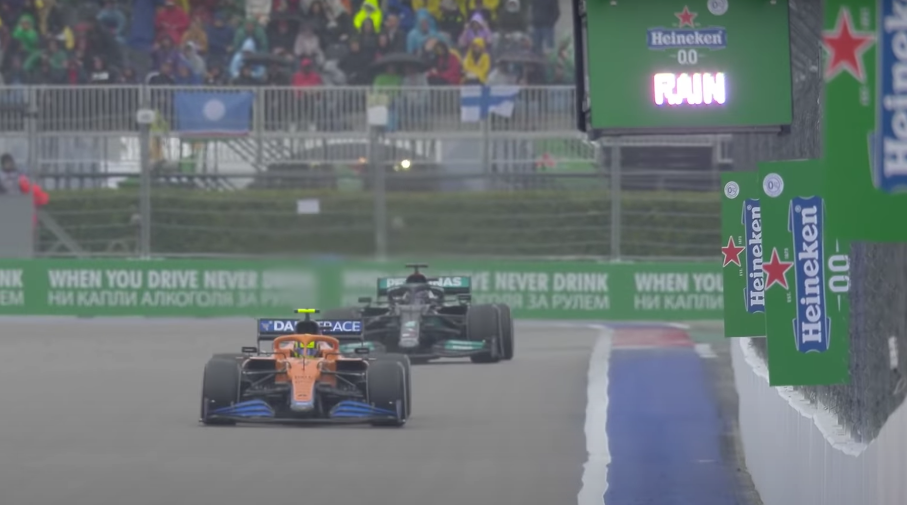 Lewis Hamilton closes on Lando Norris as the rain begins to fall at the Russian Grand Prix.