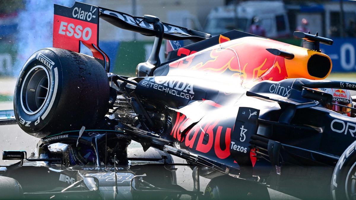 Max Verstappen's wheel strikes Lewis Hamilton's helmet.
